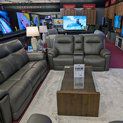Living room furniture and televisions on display at ABC Warehouse Fort Wayne